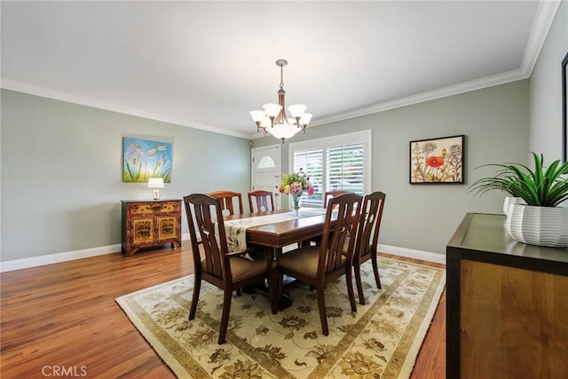 17152 Friml Ln, Huntington Beach, CA 92649 - dining room featuring a chandelier, baseboards, ornamental molding, and light wood finished floors