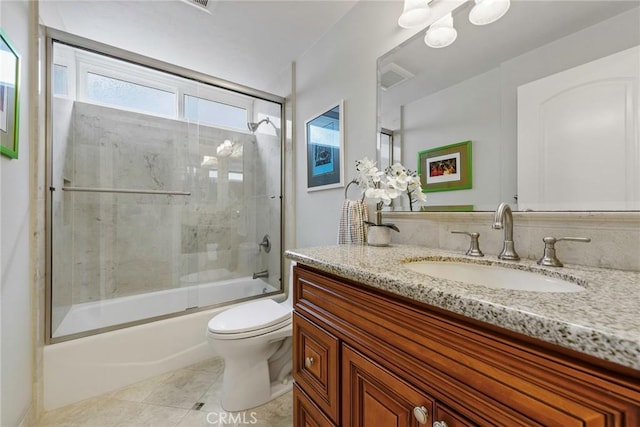 17152 Friml Ln, Huntington Beach, CA 92649 - full bath featuring toilet, vanity, enclosed tub / shower combo, and tile patterned flooring
