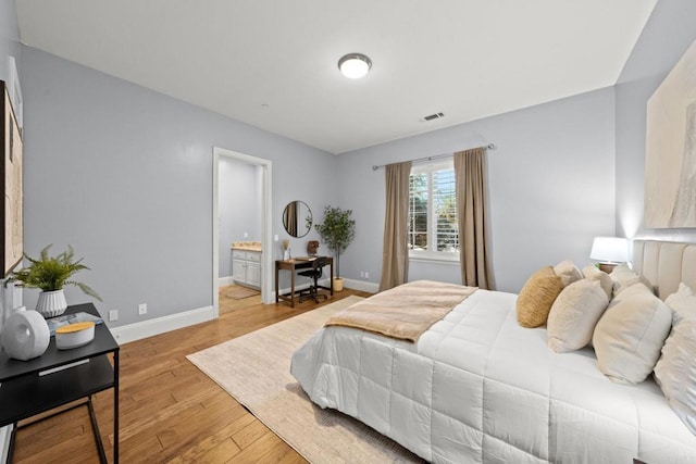 3401 Adams Run, Encinitas, CA 92024 - bedroom with wood finished floors, baseboards, and ensuite bath