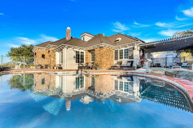 3401 Adams Run, Encinitas, CA 92024 - back of property with a chimney, fence, a patio area, and stone siding