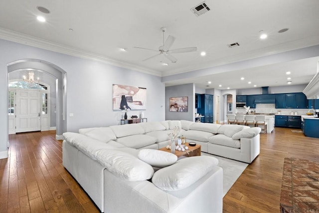 3401 Adams Run, Encinitas, CA 92024 - living room with arched walkways, ceiling fan, ornamental molding, light wood-type flooring, and baseboards