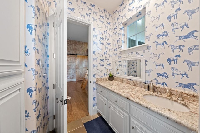 3401 Adams Run, Encinitas, CA 92024 - bathroom with wallpapered walls, vanity, and tile patterned floors
