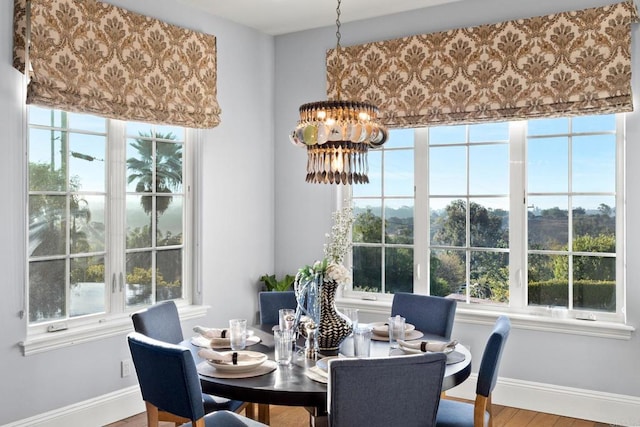 3401 Adams Run, Encinitas, CA 92024 - dining area with a chandelier, baseboards, and plenty of natural light