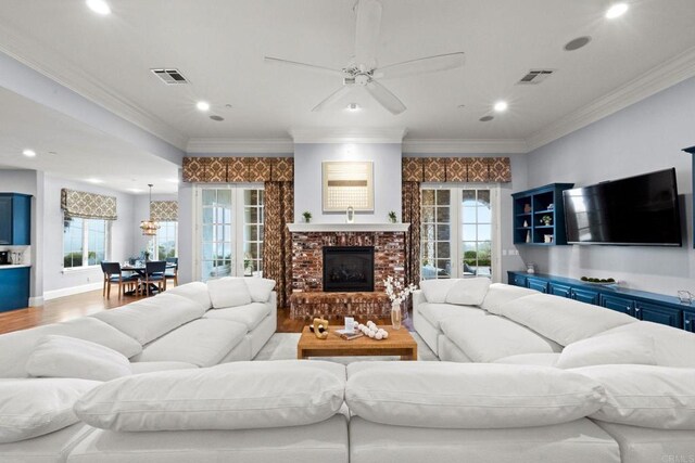 3401 Adams Run, Encinitas, CA 92024 - living room with wood finished floors, recessed lighting, ceiling fan, a brick fireplace, and ornamental molding
