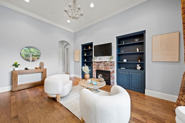 3401 Adams Run, Encinitas, CA 92024 - living area featuring arched walkways, hardwood / wood-style floors, a fireplace, recessed lighting, and a chandelier