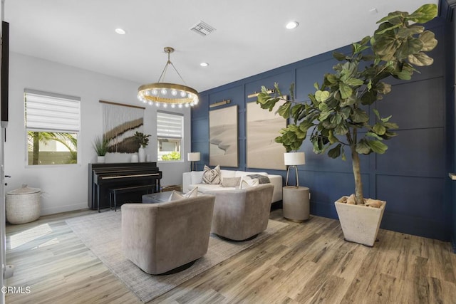 4173 Caribbean St, Oxnard, CA 93035 - living area featuring light wood-style floors, a decorative wall, recessed lighting, and a chandelier
