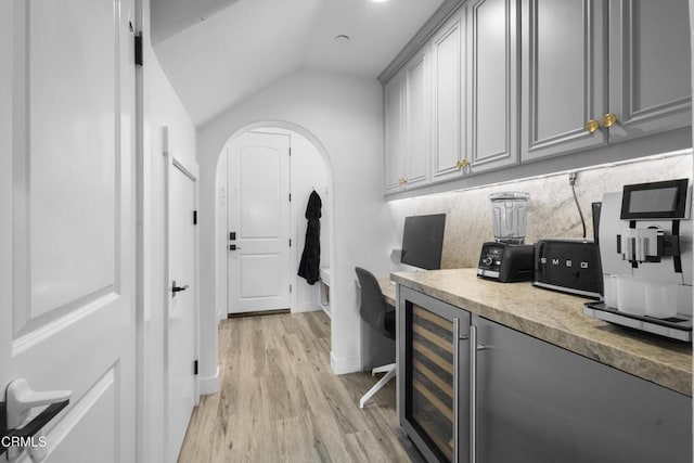 4173 Caribbean St, Oxnard, CA 93035 - washroom featuring wine cooler, arched walkways, and light wood-style flooring