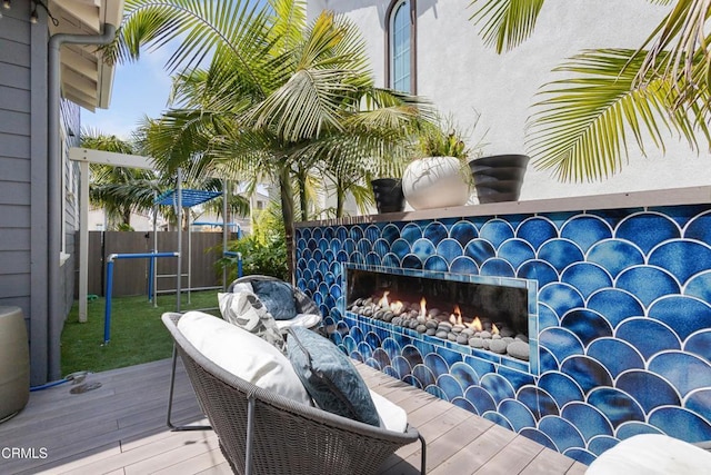 4173 Caribbean St, Oxnard, CA 93035 - wooden deck with a lit fireplace