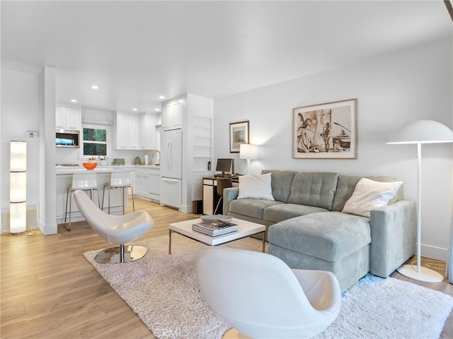 3818 Hollyline Ave, Sherman Oaks, CA 91423 - living room featuring light wood finished floors, baseboards, and recessed lighting