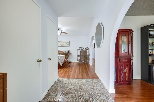 25681 Westover Cir, Lake Forest, CA 92630 - hall featuring arched walkways, wood finished floors, and baseboards