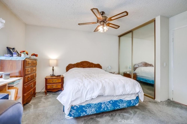 25681 Westover Cir, Lake Forest, CA 92630 - bedroom with a closet, light carpet, a textured ceiling, and ceiling fan