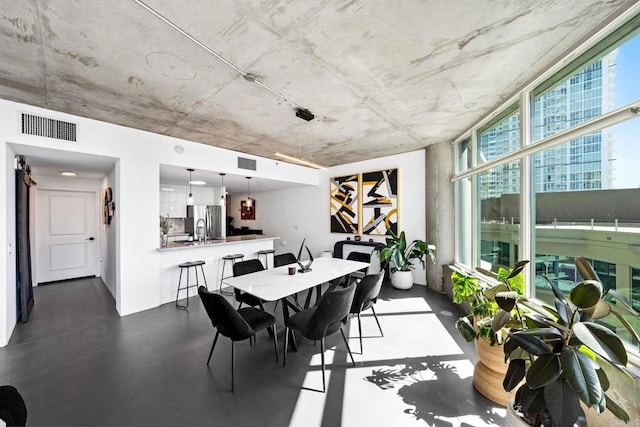 1080 Park Blvd Unit 701, San Diego, CA 92101 - dining room with concrete floors
