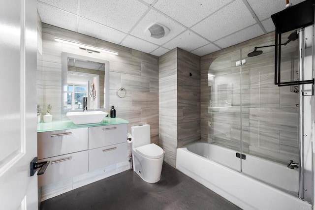 1080 Park Blvd Unit 701, San Diego, CA 92101 - bathroom featuring toilet, bath / shower combo with glass door, vanity, and a paneled ceiling