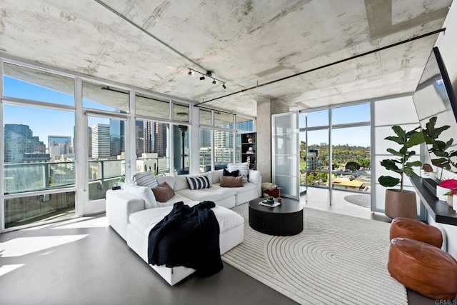 1080 Park Blvd Unit 701, San Diego, CA 92101 - sunroom featuring a wall of windows, a city view, and finished concrete flooring