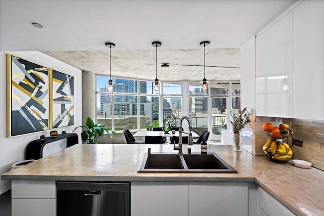1080 Park Blvd Unit 701, San Diego, CA 92101 - kitchen with dishwashing machine, a sink, white cabinetry, and a city view
