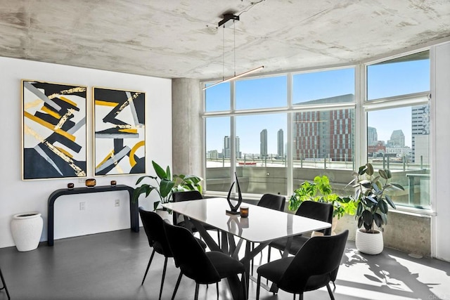 1080 Park Blvd Unit 701, San Diego, CA 92101 - dining area with a skyline view and finished concrete floors