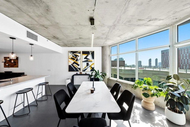 1080 Park Blvd Unit 701, San Diego, CA 92101 - dining space with finished concrete floors and a view of skyline
