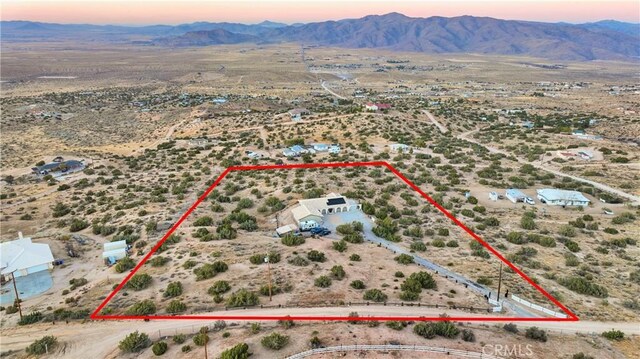 25624 Castlerock Rd, Apple Valley, CA 92308 - aerial view at dusk of property boundaries highlighted, a mountain view, view of desert, and a view of rural / pastoral area