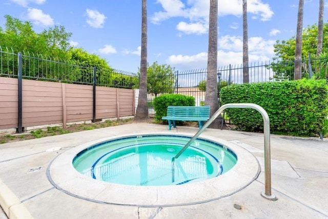 1800 E Heim Ave Unit 2, Orange, CA 92865 - view of swimming pool with a hot tub and fence
