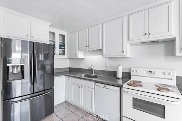 1800 E Heim Ave Unit 2, Orange, CA 92865 - kitchen with white appliances, a sink, dark countertops, white cabinetry, and light tile patterned floors