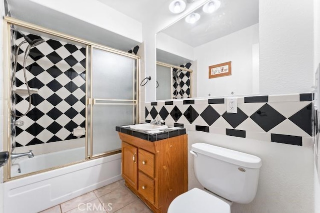 1800 E Heim Ave Unit 2, Orange, CA 92865 - bathroom with toilet, tile patterned floors, shower / bath combination with glass door, tile walls, and vanity