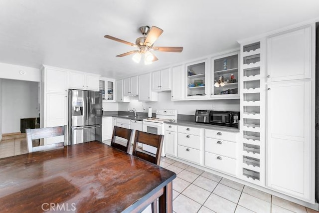 1800 E Heim Ave Unit 2, Orange, CA 92865 - kitchen featuring white appliances, light tile patterned floors, a sink, glass insert cabinets, and ceiling fan