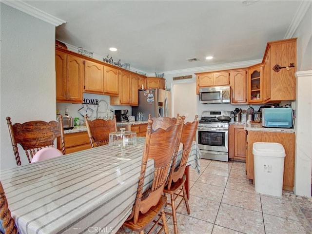 10922 Vickers Dr, Garden Grove, CA 92840 - kitchen featuring stainless steel appliances, crown molding, light countertops, recessed lighting, and light tile patterned floors
