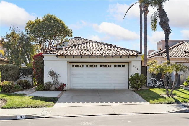 537 Avenida Buenos Aires, San Clemente, CA 92672 - mediterranean / spanish house with concrete driveway, a tiled roof, stucco siding, and an attached garage