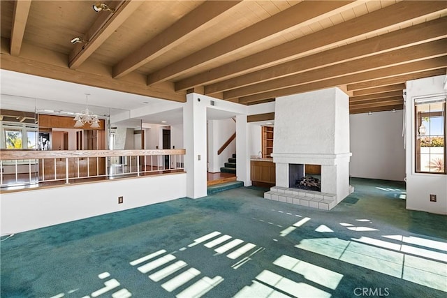 537 Avenida Buenos Aires, San Clemente, CA 92672 - unfurnished living room with stairway, a fireplace, beamed ceiling, a chandelier, and wood ceiling