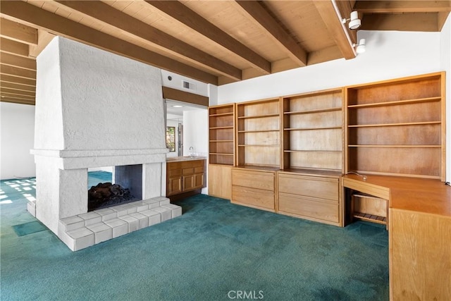 537 Avenida Buenos Aires, San Clemente, CA 92672 - unfurnished living room with beam ceiling, dark colored carpet, a tiled fireplace, and wood ceiling