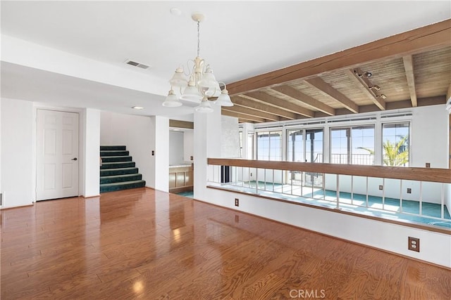 537 Avenida Buenos Aires, San Clemente, CA 92672 - unfurnished living room with wood finished floors, stairs, a chandelier, and beam ceiling