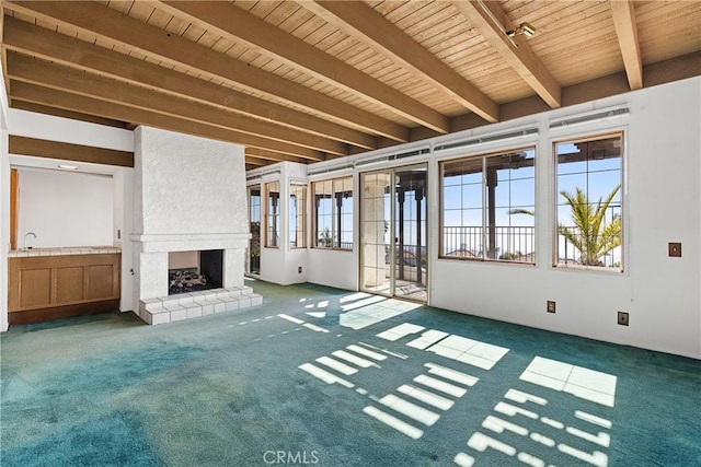 537 Avenida Buenos Aires, San Clemente, CA 92672 - unfurnished living room with wood ceiling, beamed ceiling, carpet, and a large fireplace