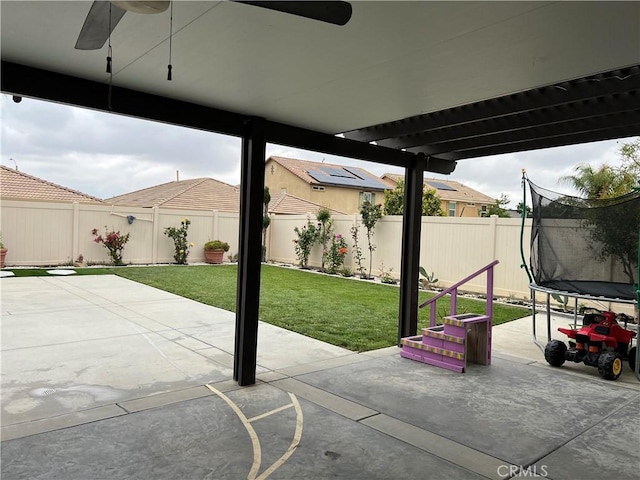 view of patio / terrace with a trampoline and a ceiling fan