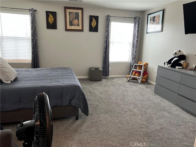 carpeted bedroom with baseboards
