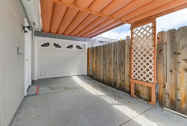 garage with fence and a gate