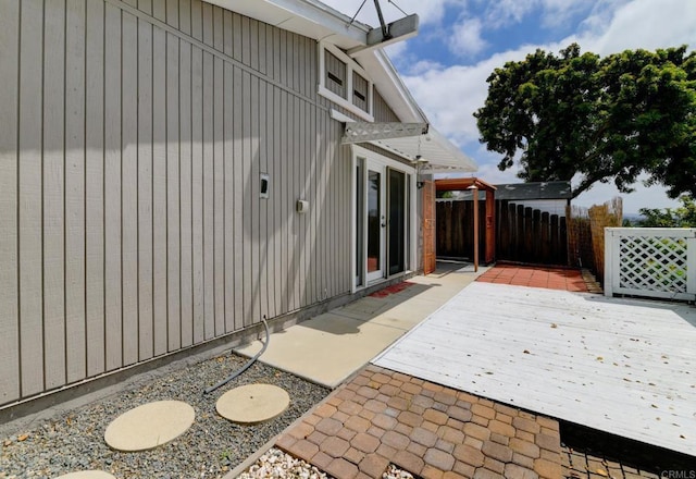 view of patio / terrace featuring fence and a wooden deck