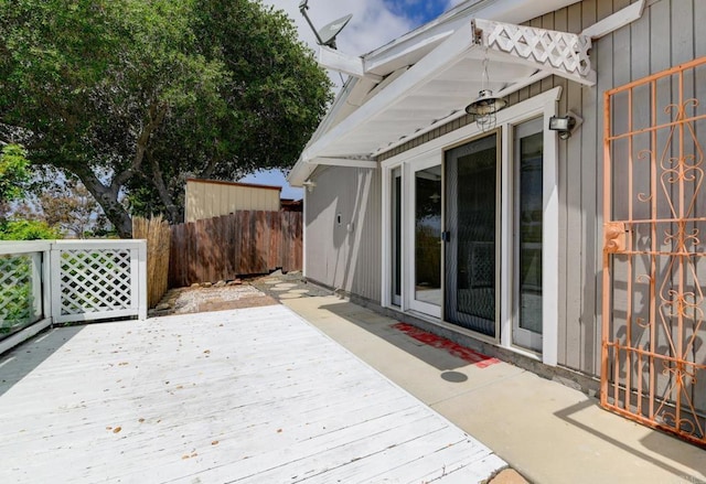 wooden deck featuring fence