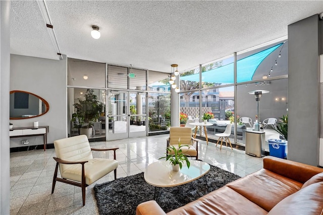 building lobby with a wall of windows and a textured ceiling