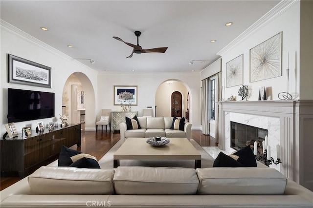 427 10th St, Huntington Beach, CA 92648 - living area featuring arched walkways, wood finished floors, a ceiling fan, recessed lighting, and baseboards