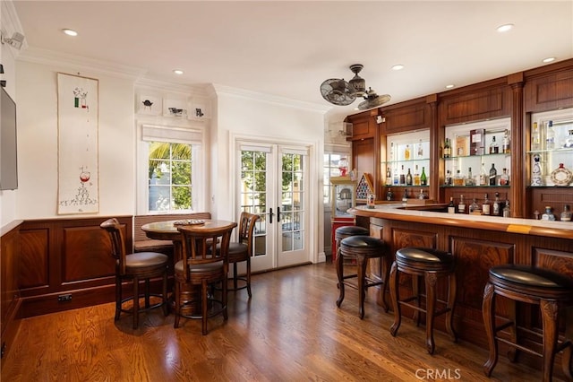 427 10th St, Huntington Beach, CA 92648 - indoor dry bar featuring dark wood-type flooring, crown molding, recessed lighting, and french doors