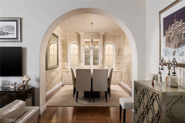 427 10th St, Huntington Beach, CA 92648 - dining room with arched walkways, light wood-style floors, baseboards, and ornamental molding