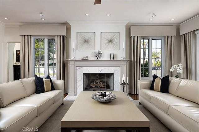 427 10th St, Huntington Beach, CA 92648 - living area featuring a high end fireplace, crown molding, and recessed lighting