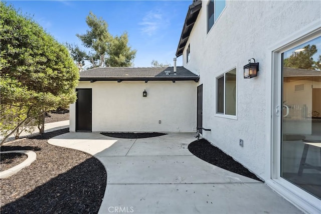 529 Manzanita Rd, Redlands, CA 92373 - property entrance featuring stucco siding and a patio