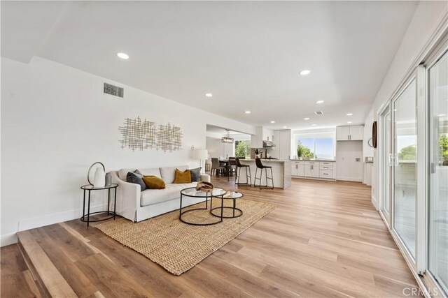 529 Manzanita Rd, Redlands, CA 92373 - living area featuring recessed lighting, light wood-type flooring, and baseboards