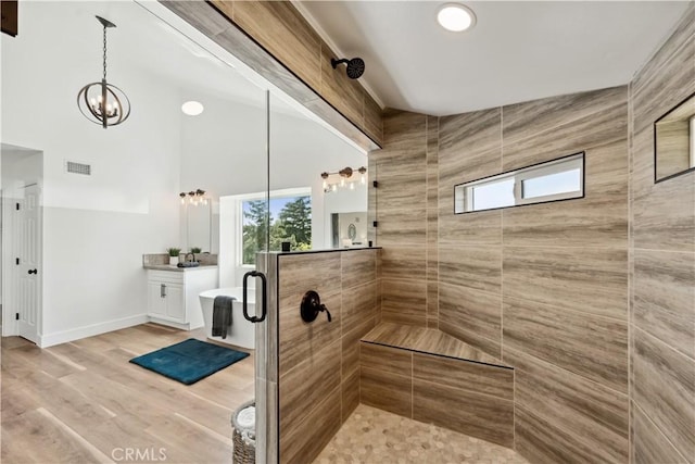 529 Manzanita Rd, Redlands, CA 92373 - full bath with a stall shower, healthy amount of natural light, a chandelier, vanity, and a towering ceiling