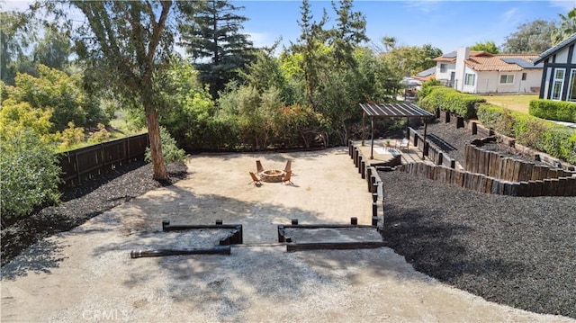 529 Manzanita Rd, Redlands, CA 92373 - view of yard with an outdoor fire pit and fence