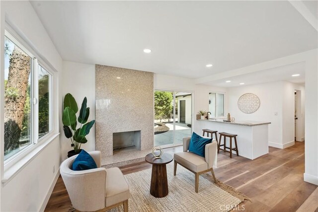 529 Manzanita Rd, Redlands, CA 92373 - living area with recessed lighting, baseboards, light wood finished floors, and a large fireplace