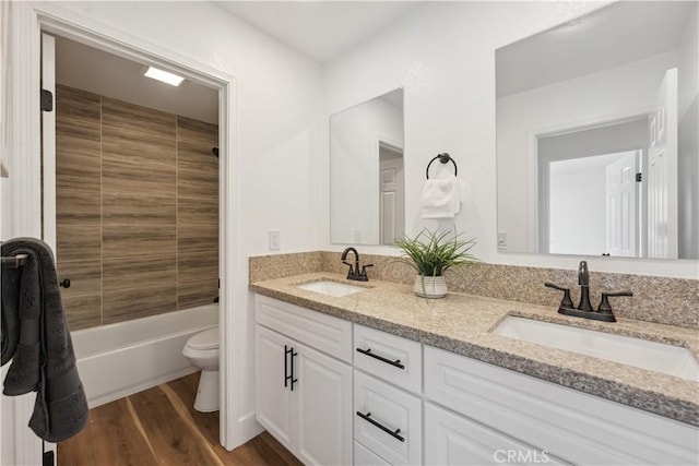 529 Manzanita Rd, Redlands, CA 92373 - bathroom featuring wood finished floors, toilet, double vanity, and  shower combination