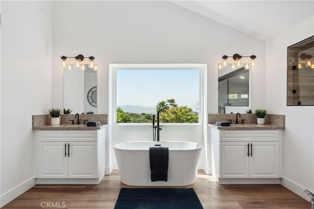 529 Manzanita Rd, Redlands, CA 92373 - full bathroom with vaulted ceiling, healthy amount of natural light, wood finished floors, and two vanities