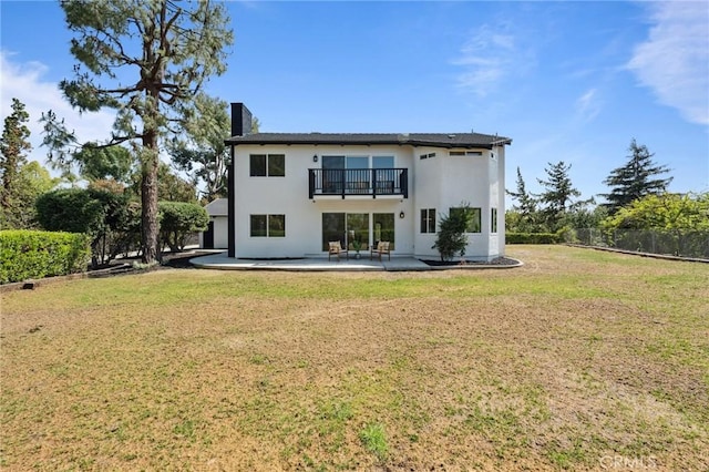 529 Manzanita Rd, Redlands, CA 92373 - back of house featuring a balcony, stucco siding, a patio area, and a chimney